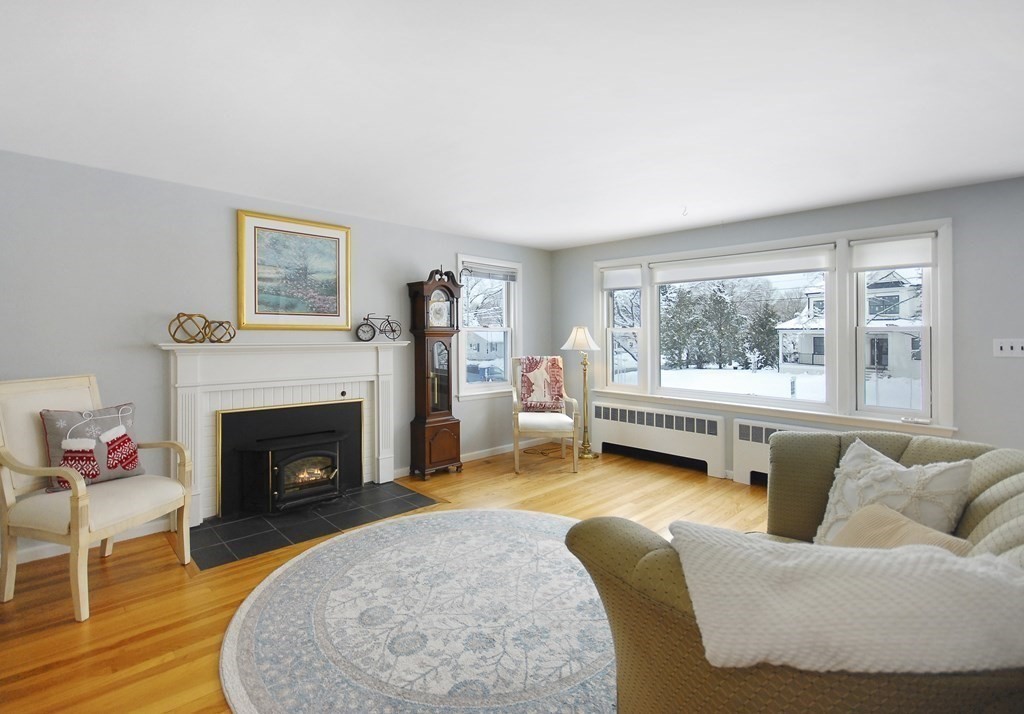 82 Powers Road Concord, MA 01742 - Photo 8 of 35 a living room with furniture and a fireplace