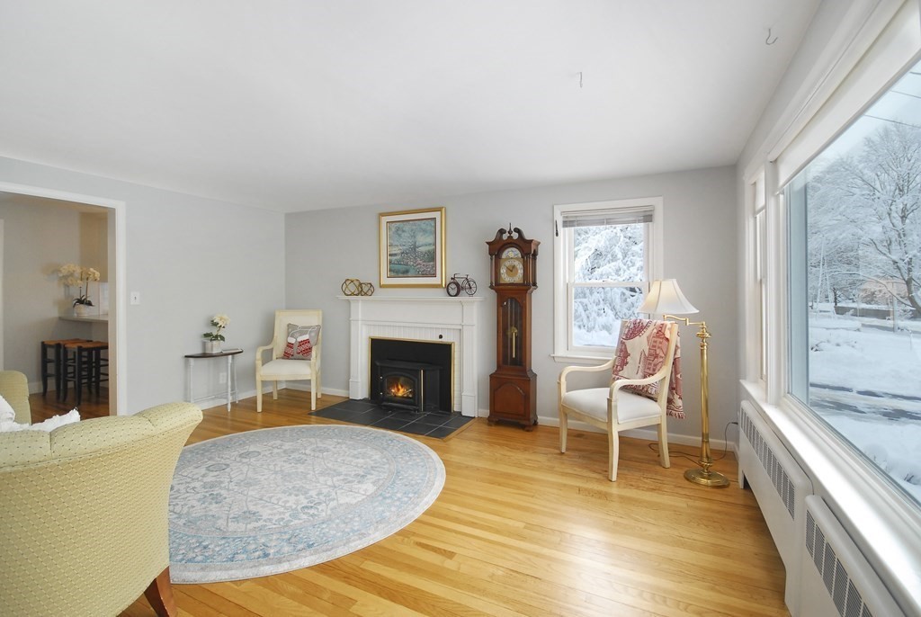82 Powers Road Concord, MA 01742 - Photo 9 of 35 a living room with furniture and a fireplace