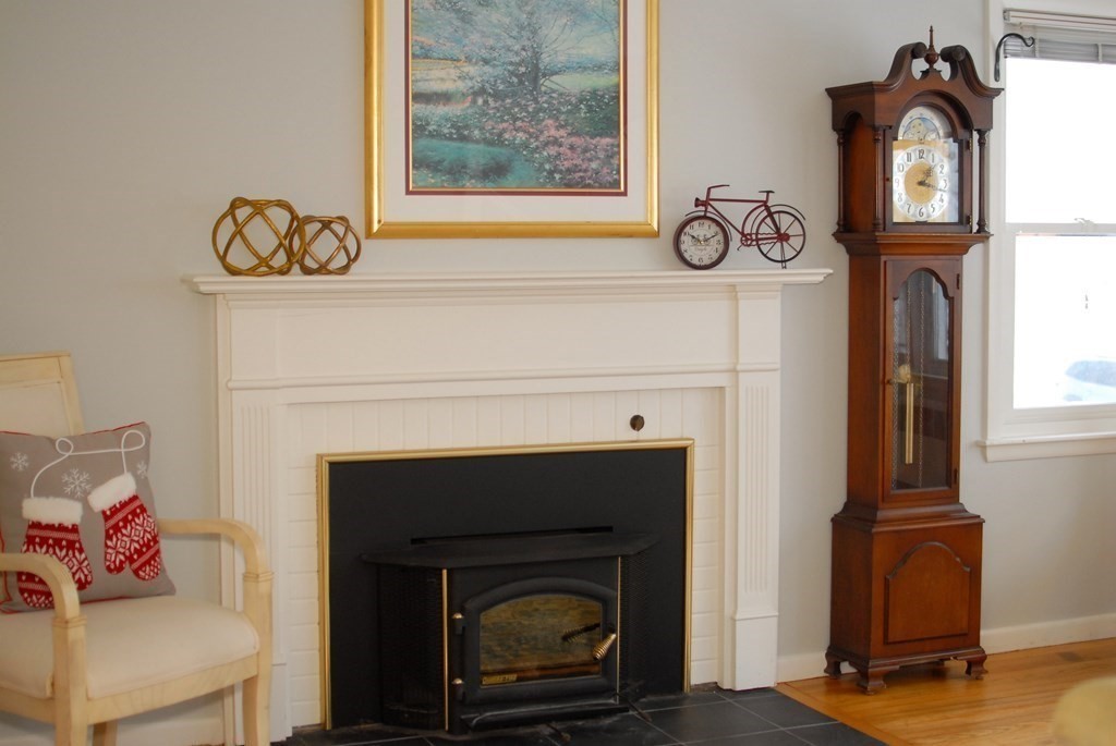 82 Powers Road Concord, MA 01742 - Photo 10 of 35 a living room with furniture and a fireplace