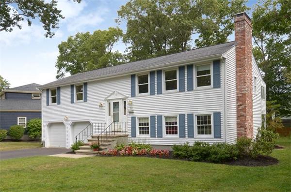 50 Gilbert Road Needham, MA 02492 - Photo 1 of 25 a front view of a house with a yard and porch