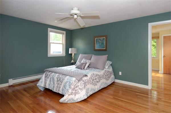 50 Gilbert Road Needham, MA 02492 - Photo 11 of 25 a bedroom with a bed and wooden floor