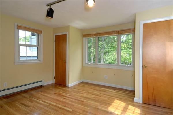 50 Gilbert Road Needham, MA 02492 - Photo 13 of 25 a view of an empty room with wooden floor and a window
