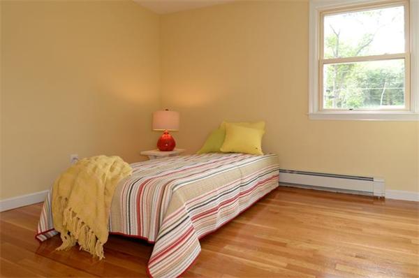 50 Gilbert Road Needham, MA 02492 - Photo 15 of 25 a bedroom with a bed and a window