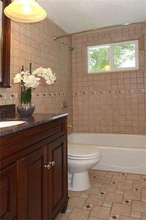 50 Gilbert Road Needham, MA 02492 - Photo 16 of 25 a bathroom with a sink a toilet and bathtub