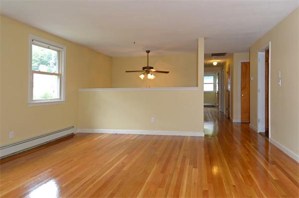 50 Gilbert Road Needham, MA 02492 - Photo 18 of 25 an empty room with wooden floor and windows