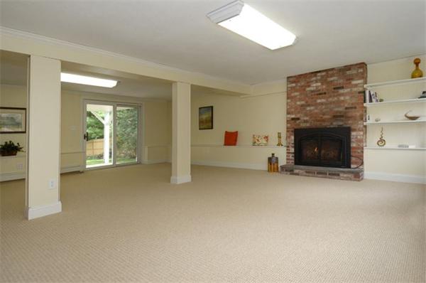 50 Gilbert Road Needham, MA 02492 - Photo 20 of 25 a view of a livingroom with an empty space and a fireplace