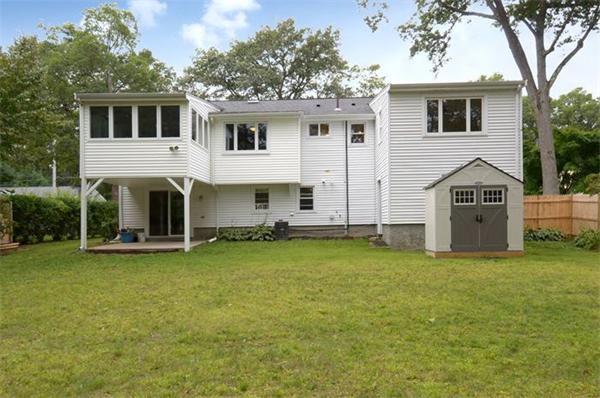50 Gilbert Road Needham, MA 02492 - Photo 24 of 25 a front view of a house with a yard