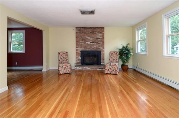50 Gilbert Road Needham, MA 02492 - Photo 3 of 25 a living room with furniture and a fireplace