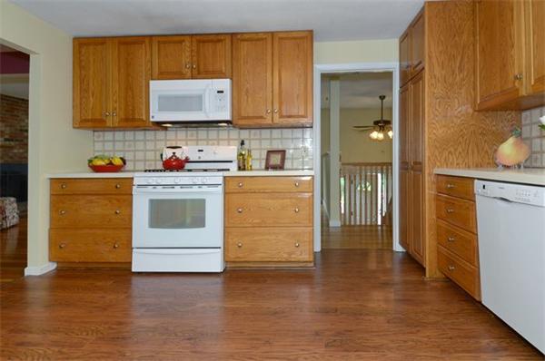 50 Gilbert Road Needham, MA 02492 - Photo 5 of 25 a kitchen with stainless steel appliances granite countertop a stove and a refrigerator