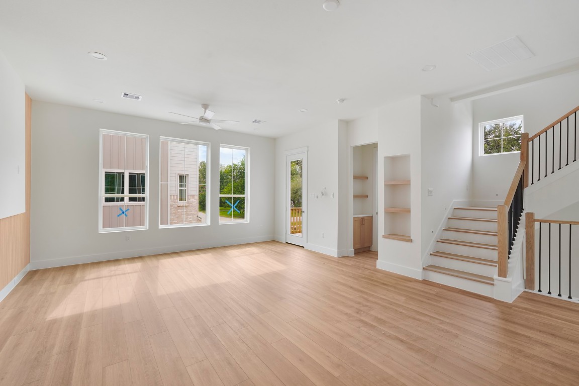 1106 Weiss Street Houston, TX 77009 - Photo 12 of 13 a view of an empty room with wooden floor and a window