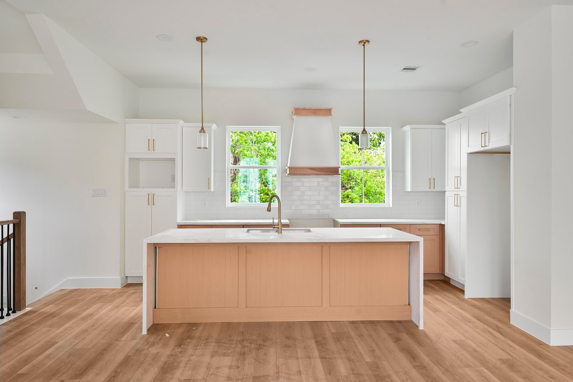 1106 Weiss Street Houston, TX 77009 - Photo 5 of 13 a kitchen with kitchen island a window a island and stainless steel appliances