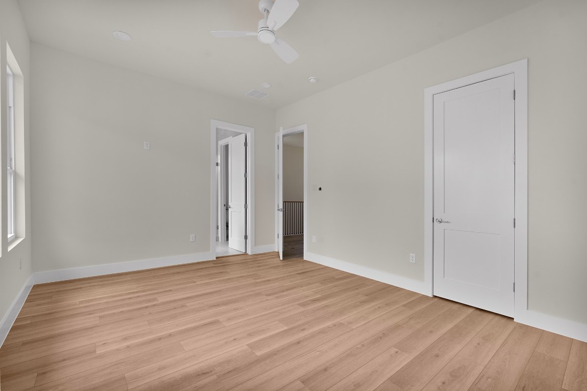 1106 Weiss Street Houston, TX 77009 - Photo 8 of 13 a view of an empty room with wooden floor and a window