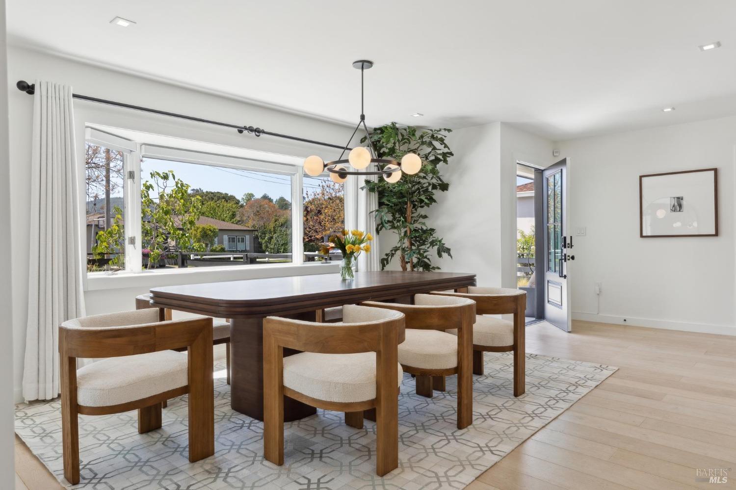 31 Mohawk Avenue Corte Madera, CA 94925 - Photo 8 of 57 a dining room with furniture a chandelier and wooden floor