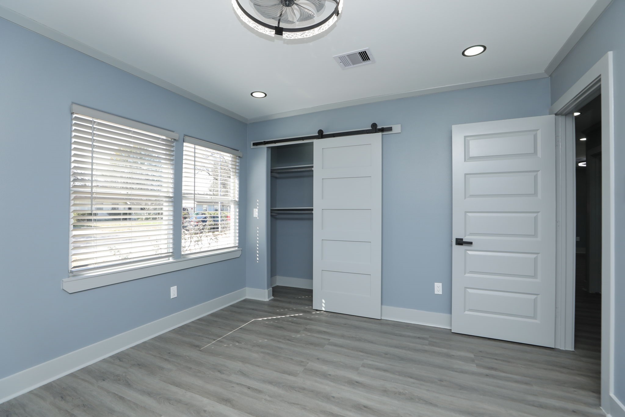 4047 Juliet Street Houston, TX 77087 - Photo 31 of 38 a view of an empty room with a window and wooden floor