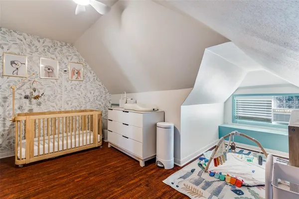 a view of a park with large trees