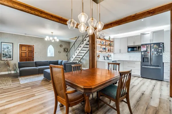 a dining room with furniture and window