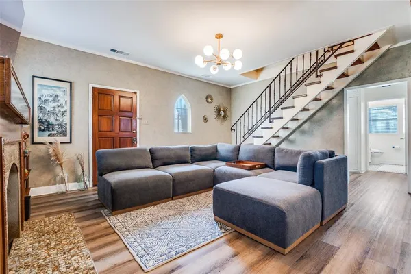 a living room with furniture fireplace and flat screen tv