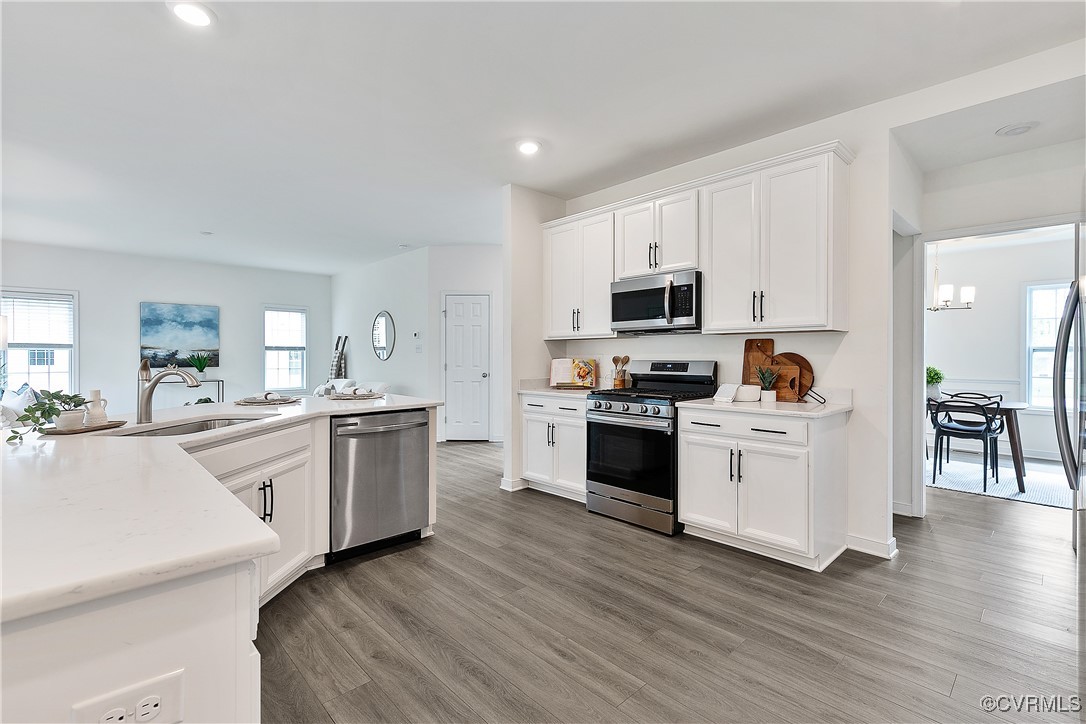 11506 Avening Road Midlothian, VA 23112 - Photo 21 of 50 a kitchen with granite countertop white cabinets and white appliances