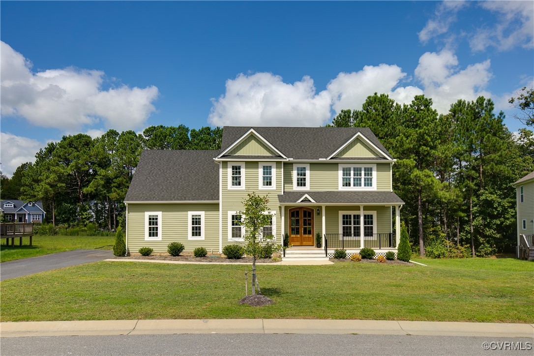 11506 Avening Road Midlothian, VA 23112 - Photo 3 of 50 a front view of a house with a yard