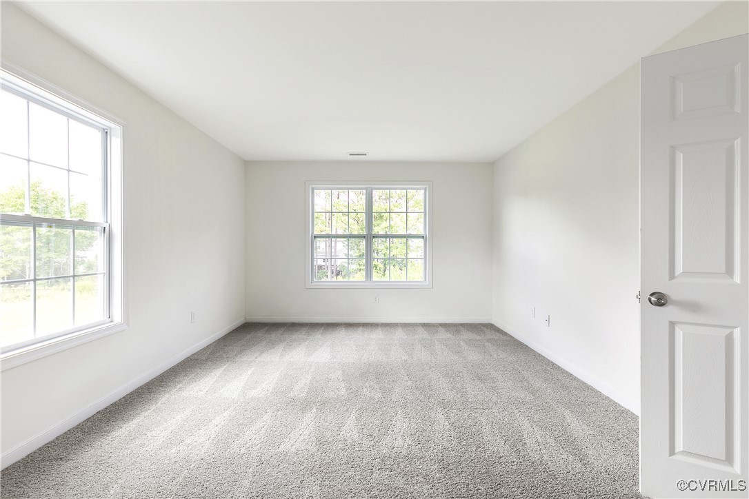 11506 Avening Road Midlothian, VA 23112 - Photo 42 of 50 an empty room with windows