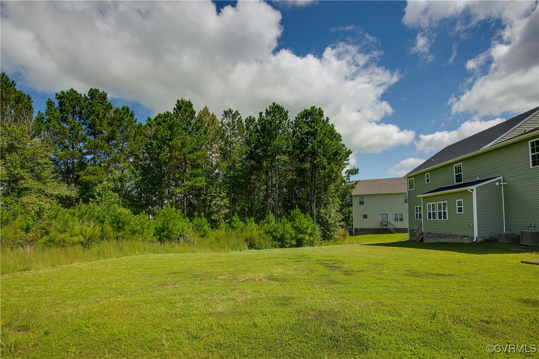 11506 Avening Road Midlothian, VA 23112 - Photo 46 of 50 a front view of a house with garden