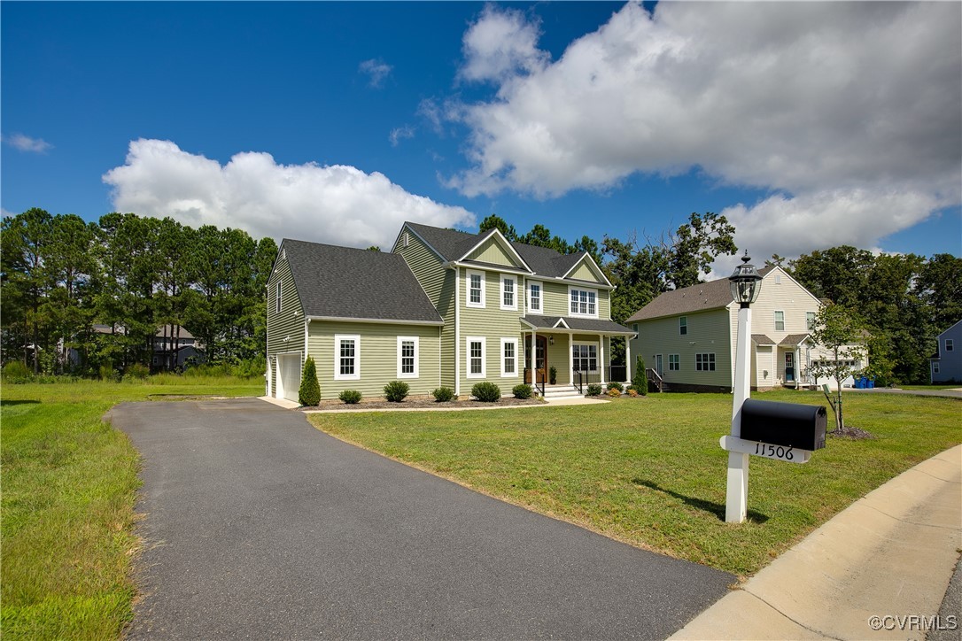11506 Avening Road Midlothian, VA 23112 - Photo 5 of 50 a front view of a house with garden