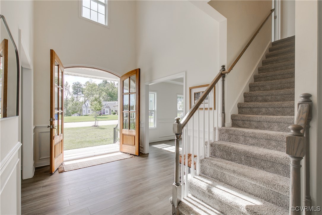 11506 Avening Road Midlothian, VA 23112 - Photo 10 of 50 a view of staircase with white walls and windows