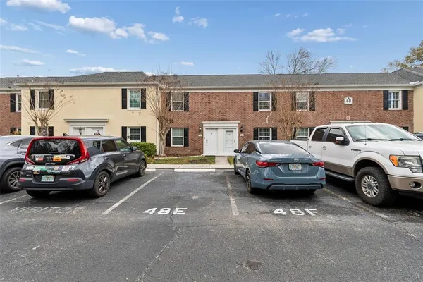 a view of a cars in front of a house