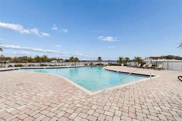 an aerial view of a house with a yard and outdoor seating