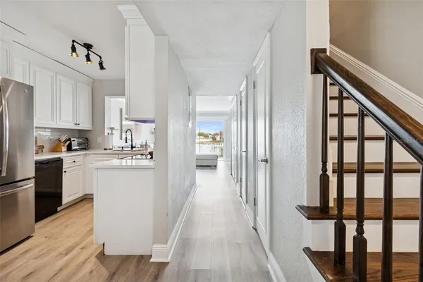 a view of an entryway with wooden floor