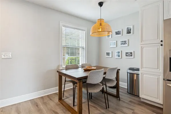 a view of a dining room with furniture and wooden floor