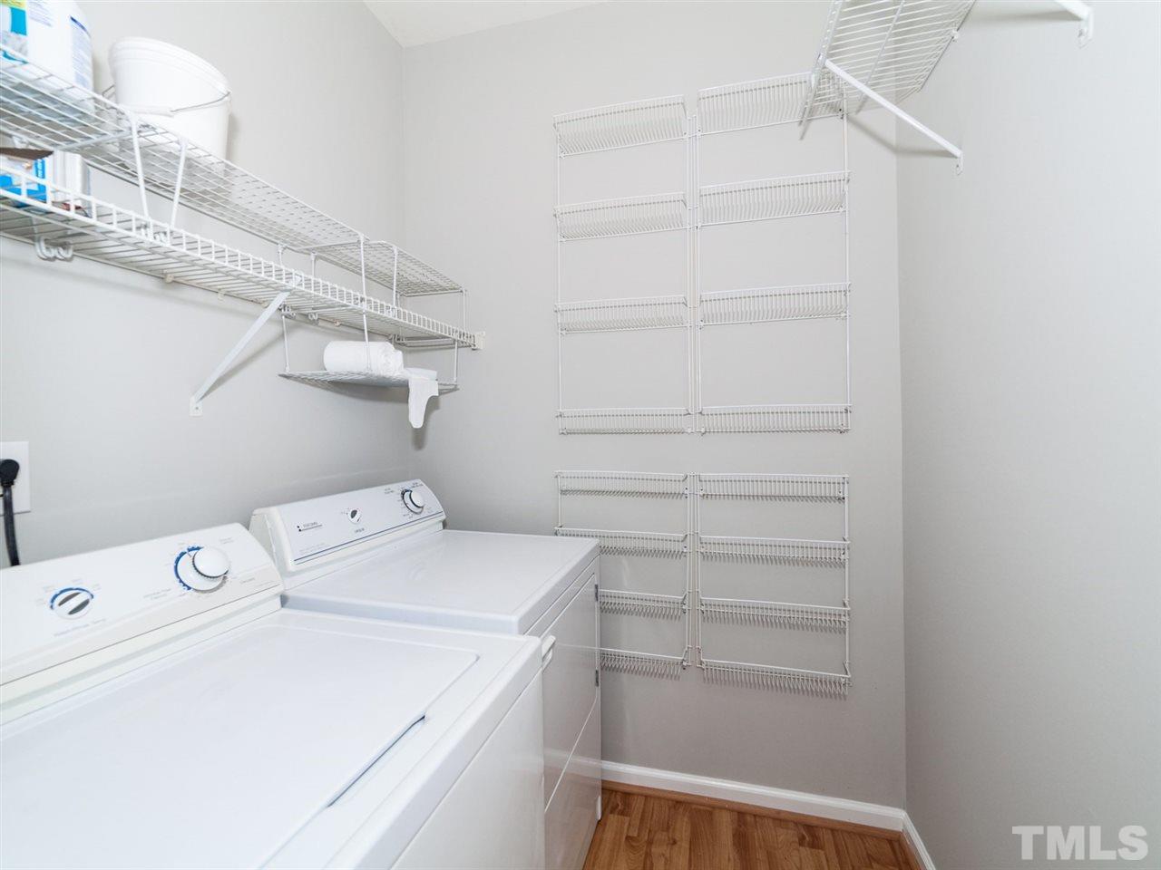 7030 Sandy Forks Road, Unit 102 Raleigh, NC 27615 - Photo 14 of 25 a view of storage and utility room with racks on the wall
