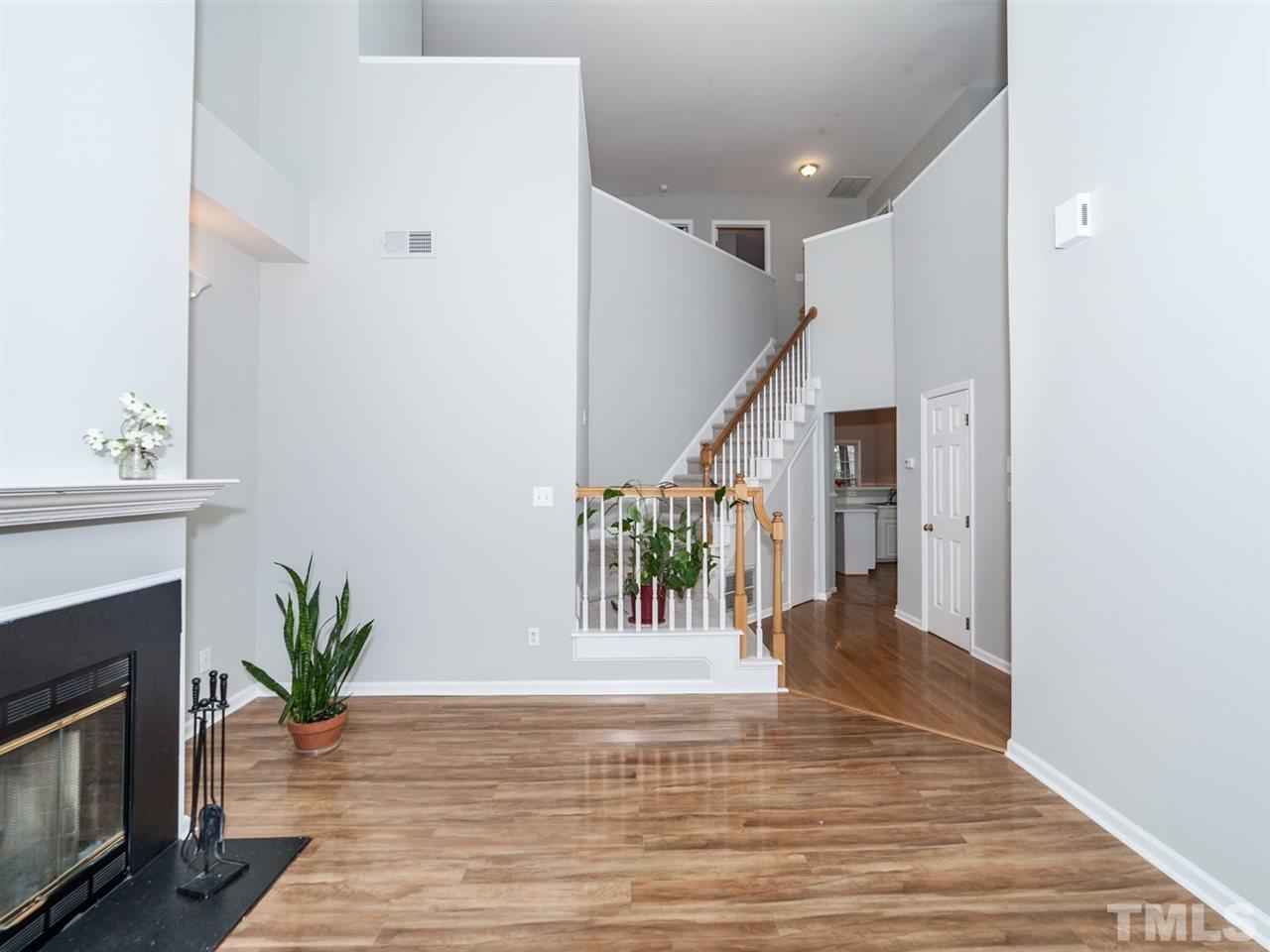 7030 Sandy Forks Road, Unit 102 Raleigh, NC 27615 - Photo 3 of 25 a view of entryway and hall with wooden floor