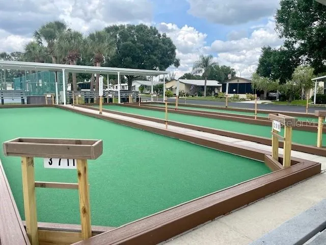 a view of an outdoor space and tennis court