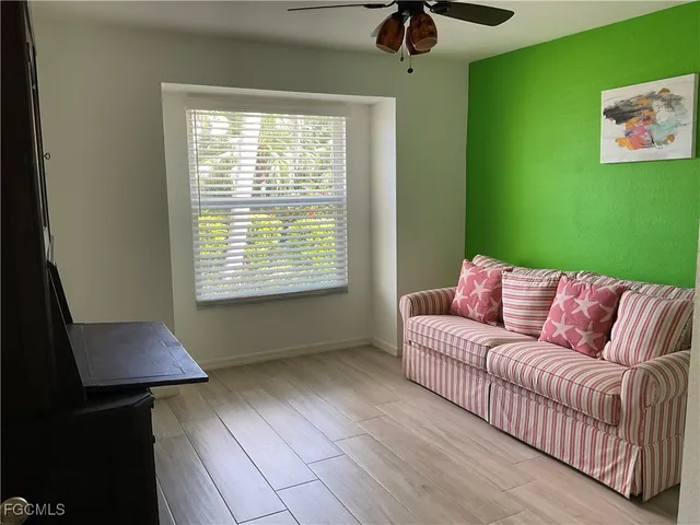 a living room with furniture and a window