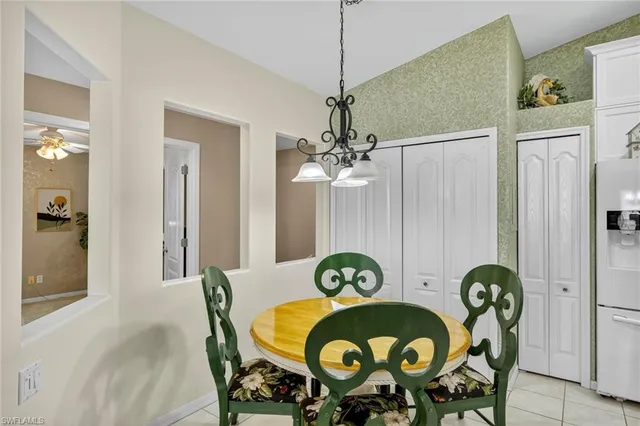 a view of a dining room and hall with furniture