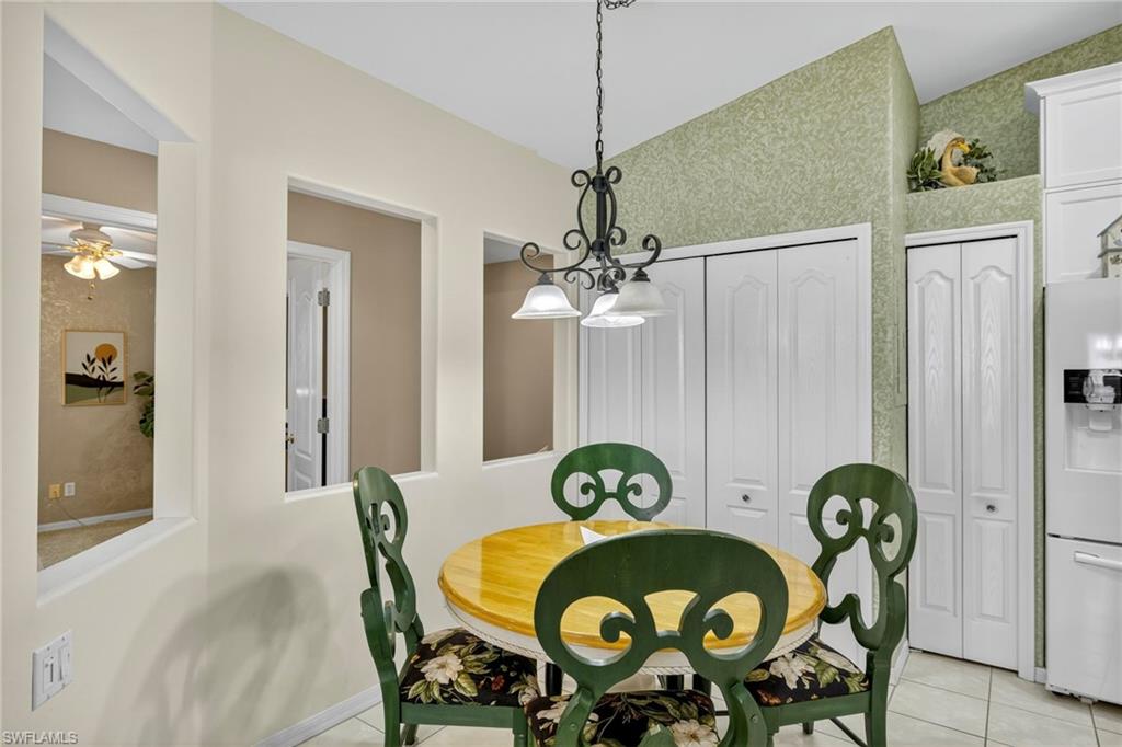 9020 Spring Run Boulevard, Unit 602 Estero, FL 34135 - Photo 13 of 47 Delightful dining option in the kitchen