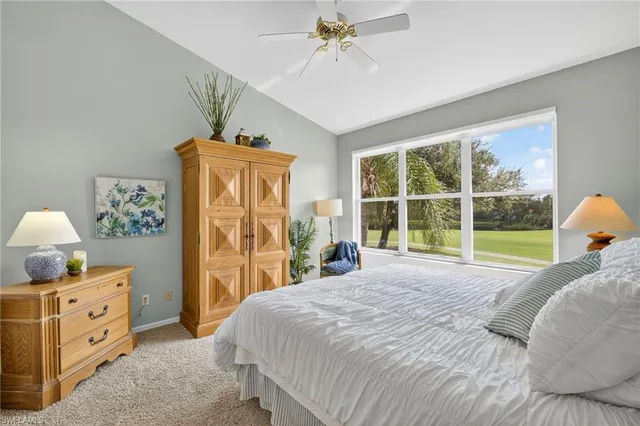 a bed room with a bed and a window