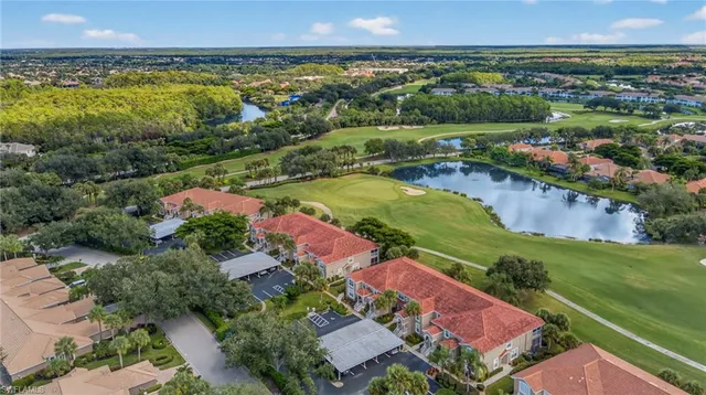 an aerial view of a houses with a lake view