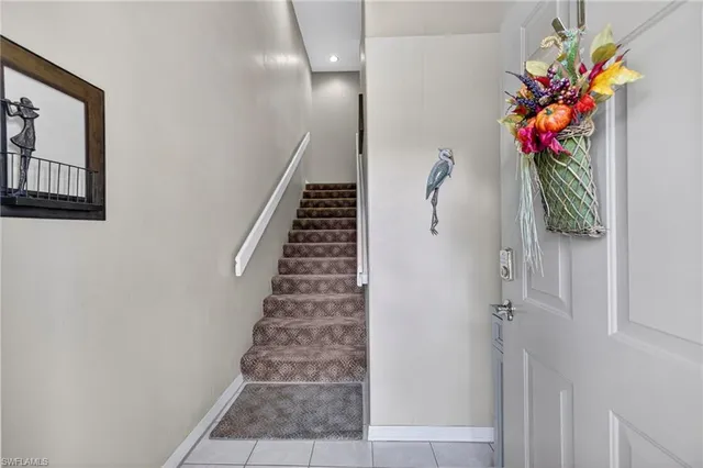 a vase of flowers sitting on a floor