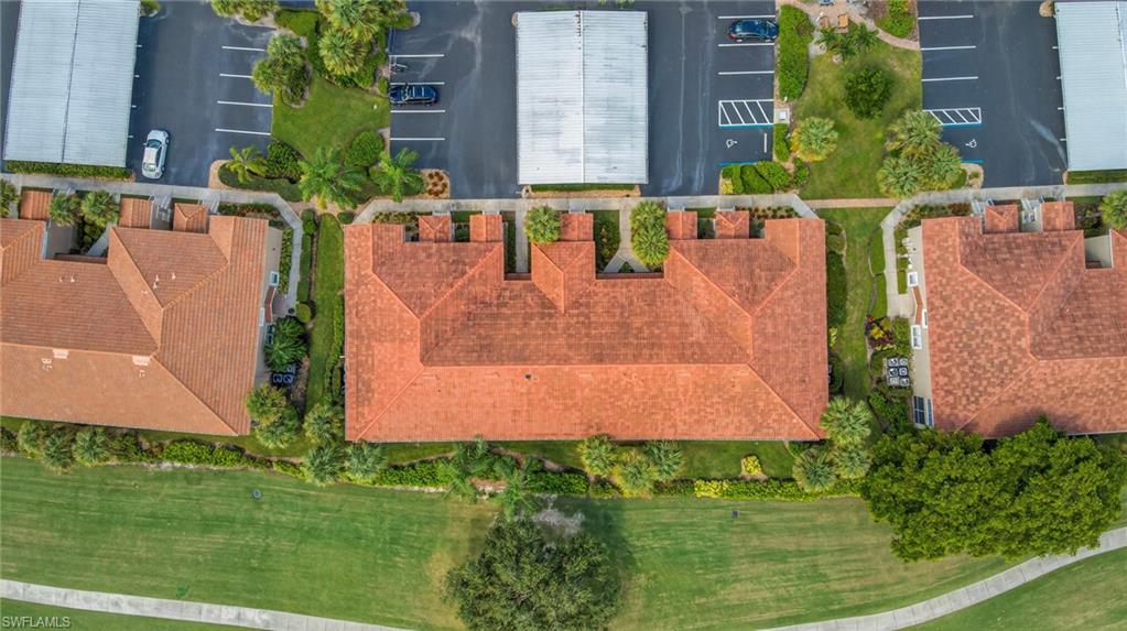 9020 Spring Run Boulevard, Unit 602 Estero, FL 34135 - Photo 37 of 47 Aerial view of condo and carport