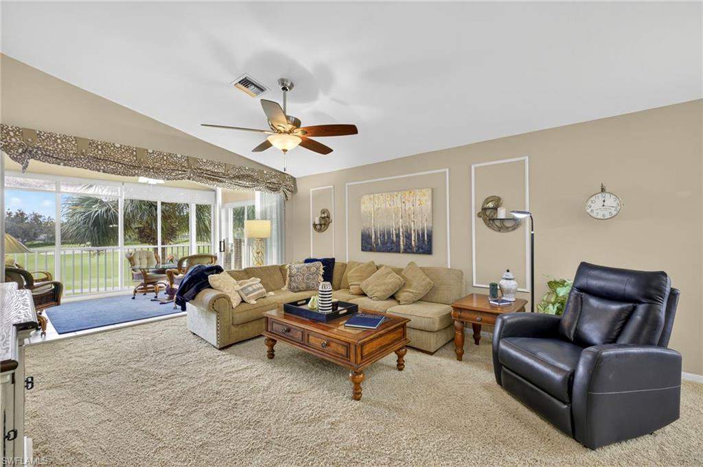 9020 Spring Run Boulevard, Unit 602 Estero, FL 34135 - Photo 4 of 47 Spacious, cozy living room with lake along the 18th fairway in Spring Run