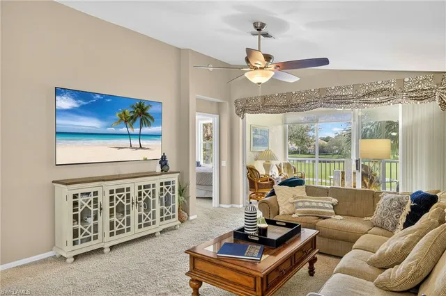 a living room with furniture fireplace and a flat screen tv