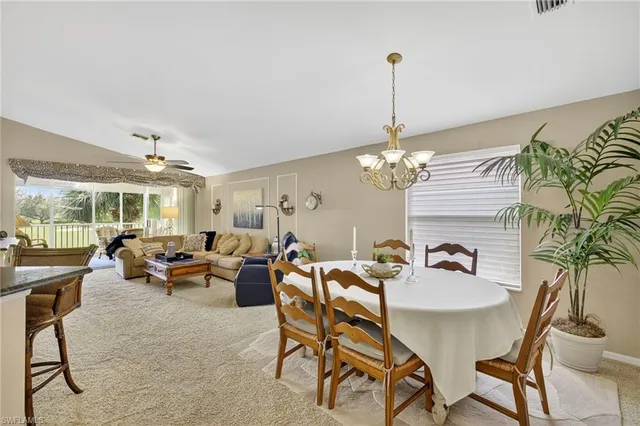a view of a livingroom with furniture and a chandelier