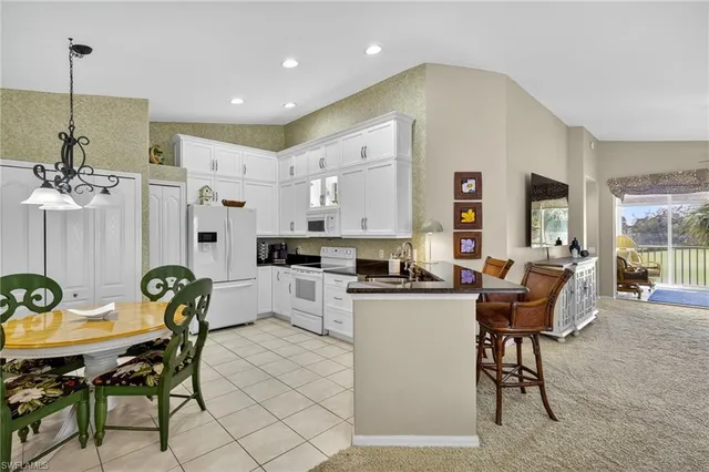 a living room with furniture a dining table and chairs