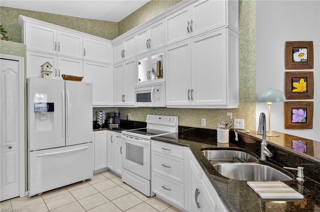 9020 Spring Run Boulevard, Unit 602 Estero, FL 34135 - Photo 10 of 47 Ample kitchen storage and counter space