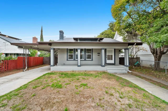 front view of a house with a yard