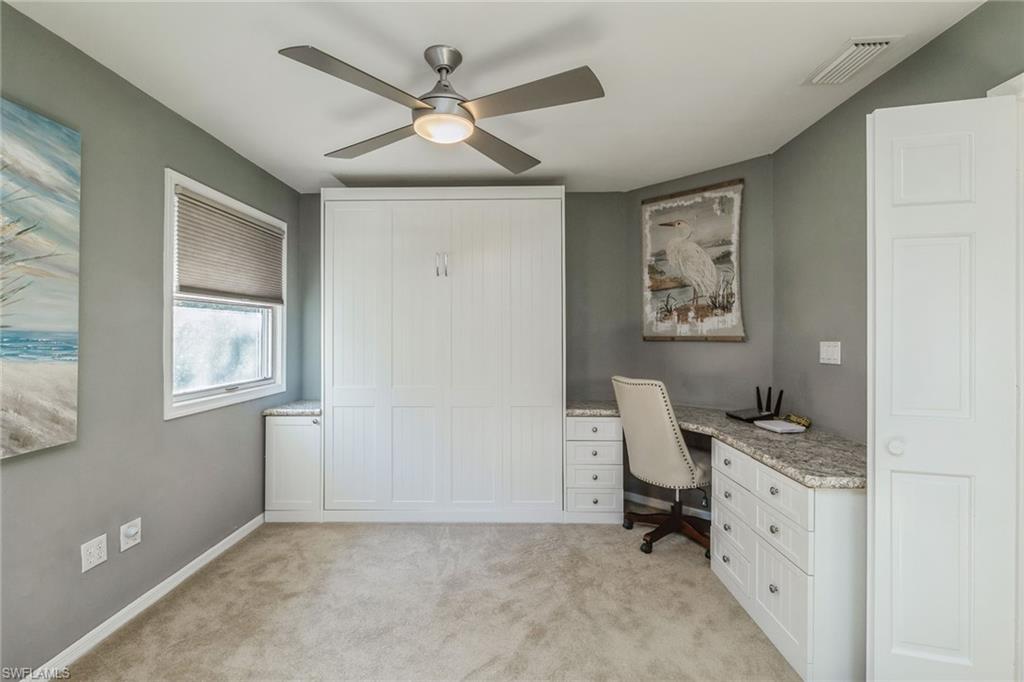 6652 Trident Way, Unit J1 Naples, FL 34108 - Photo 16 of 20 a view of workspace with wooden floor and windows