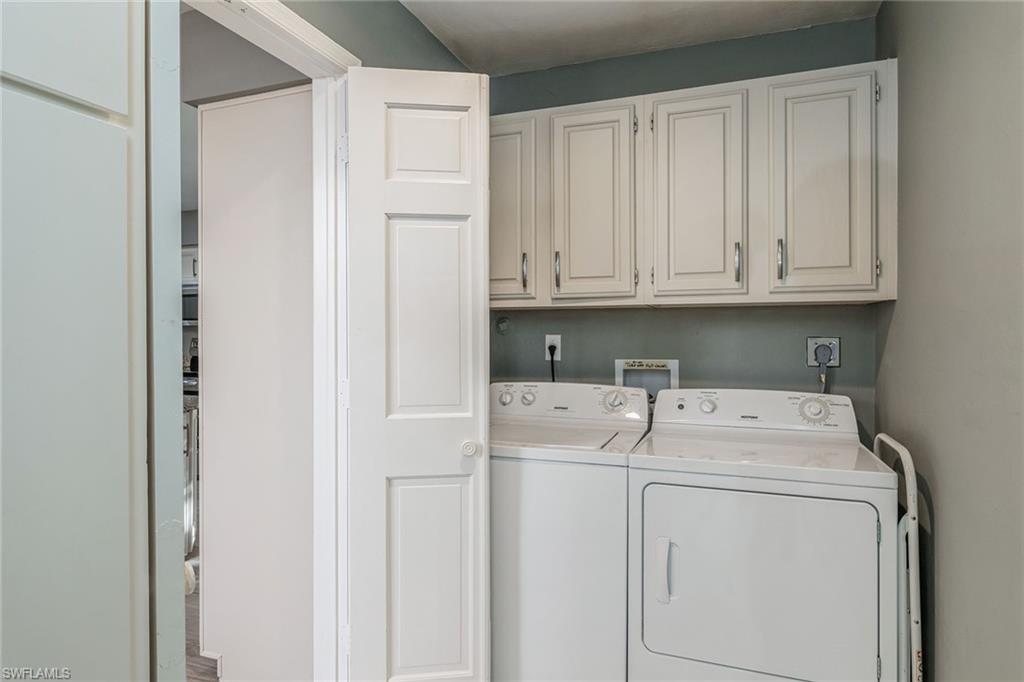 6652 Trident Way, Unit J1 Naples, FL 34108 - Photo 18 of 20 a utility room with dryer and washer