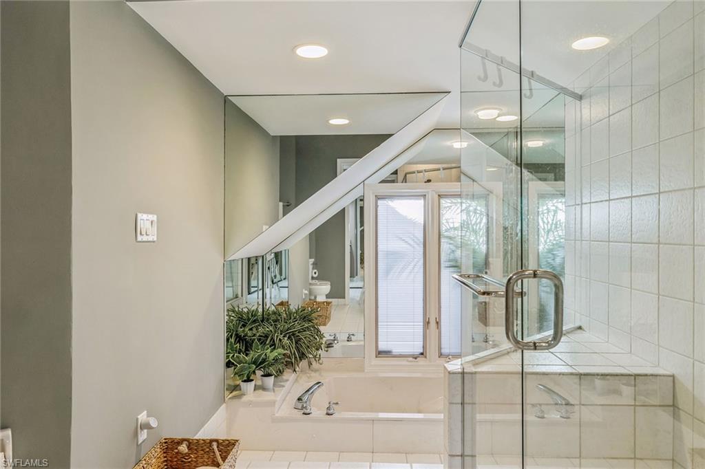 6652 Trident Way, Unit J1 Naples, FL 34108 - Photo 10 of 20 a very nice looking room with a potted plant